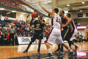 Senior forward Isaiah Armwood goes up against a Duquesne defender in the two team's matchup last season. Hatchet File Photo 