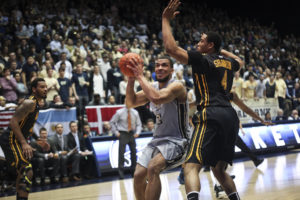 Kevin Larsen goes up in the post against VCU earlier this season. Hatchet File Photo