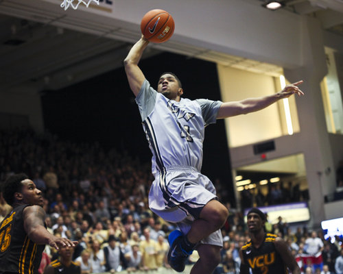 Kethan Savage goes up for a dunk against VCU in a game last season. Hatchet File Photo.