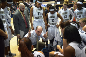 Head coach Jonathan Tsipis tries to motivate his team during its 77-68 loss to La Salle Saturday. Jordan Leon | Hatchet Photographer