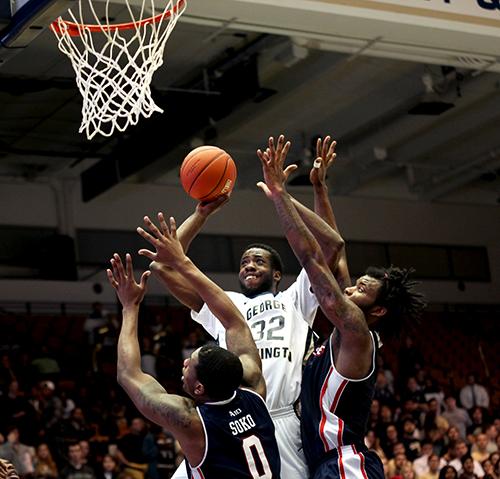 Isaiah Armwood goes up against Duquesne defenders Wednesday night. Cameron Lancaster | Assistant News Editor