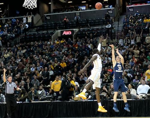 Senior Nemanja Mikic fires a three in the first half. Mikic carried GW with his hot shooting again on Saturday. Samuel Klein | Photo Editor