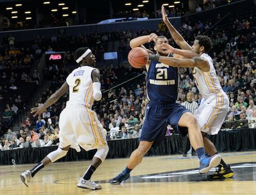 Sophomore forward Kevin Larsen loses the ball against two VCU defenders Satruday. Samuel Klein | Photo Editor