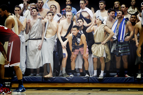 Members of the men's water polo team dressed in togas and cheered raucously earlier this year at the Smith Center. Hatchet File Photo by Cameron Lancaster