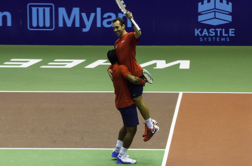Bobby Reynolds and Leander Paes celebrate after winning the men's doubles set 5-2. Their win clinched the Washington Kastle's win over the Texas Wild. Zach Montellaro | Hatchet Staff Photographer
