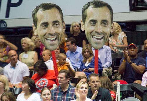 Fans hold up giant cutouts of Kastles player Bobby Reynold's head during Tuesday's match. Zach Montellaro | Hatchet Staff Photographer