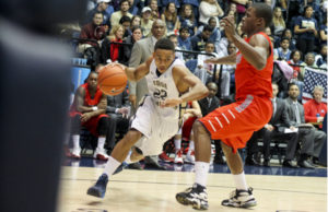 Then-sophomore guard Joe McDonald drives toward the basket against Radford last season. Hatchet File Photo by Delaney Walsh | Photo Editor 