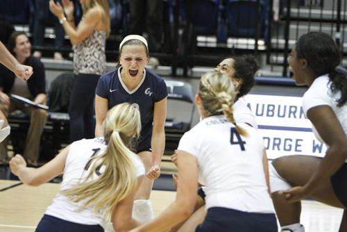 The Colonials celebrate a point in a match earlier this season. Hatchet File Photo