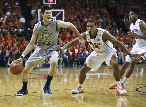 Freshman Yuta Watanabe charges into the paint at the John Paul Jones Center in Charlottesville, Va on Friday. The Colonials were dealt their first loss of the season by the Cavaliers, losing 59-42. Cameron Lancaster | Photo Editor