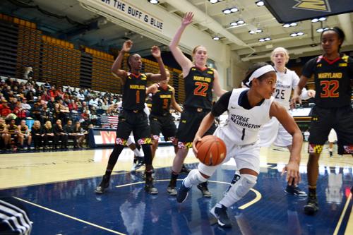 Senior Chakecia Miller dribbles past the Maryland defense. The Colonials fell to the Terrapins 65-75 at the Smith Center on Saturday. Aly Kruse | Hatchet Photographer