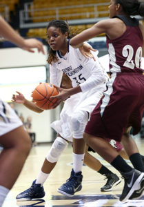 Junior Jonquel Jones drives through defenders in a game earlier this season against Virginia Union. File Photo by Dan Rich | Hatchet Photographer