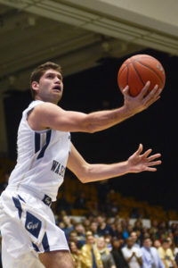 Junior guard/forward Patricio Garino completes a layup during the GW's victory over the UMBC Retrievers. Francis Rivera | Senior Staff Photographer