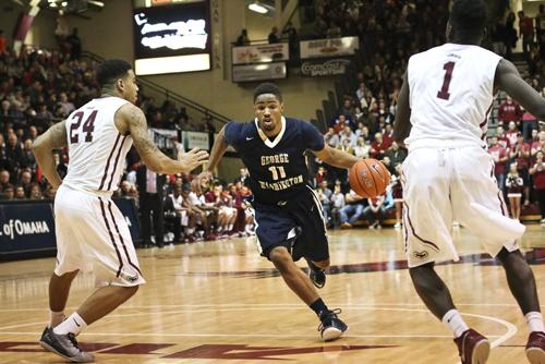 Junior Kethan Savage drives between defenders in a game earlier this season. Savage led the team with 18 points Saturday, but the Colonials couldn't stop the Spiders in a 56-48 loss on the road. Desiree Halpern | Contributing Photo Editor. 