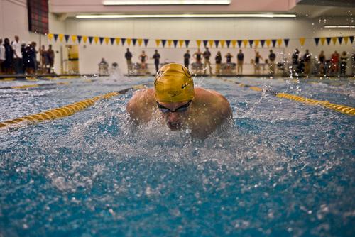 Senior Joe Lipworth charges down his lane during the men's 100-yard butterfly. Francis Rivera | Senior Staff Photographer