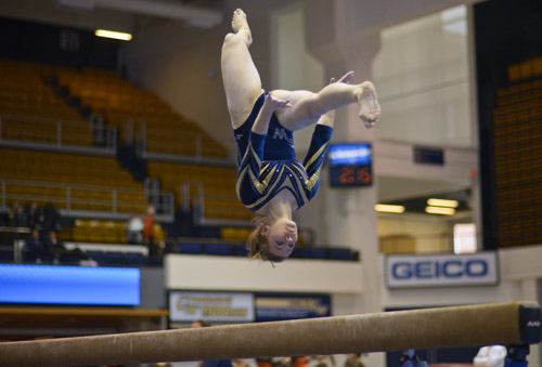 Sophomore Chelsea Raineri executes a difficult sequences towards the end of her balance beam routine. 