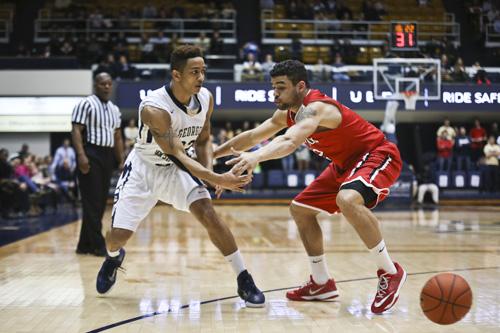 Junior Joe McDonald makes a pass in GW's Feb. 18 loss to Davidson at home. McDonald scored 20 points against the Wildcats on Saturday in the GW loss. Cameron Lancaster | Photo Editor