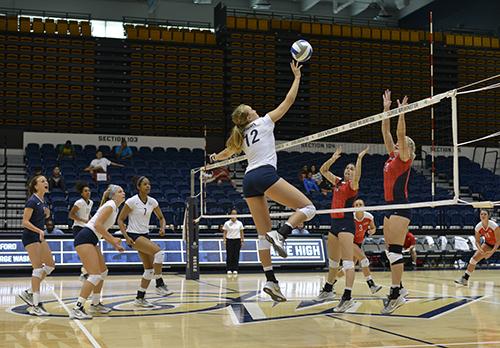 Senior Middle Blocker Maggie Skjelbred attempts a kill in the Colonials' four set win over Radford. Andrew Goodman | Hatchet Staff Photographer