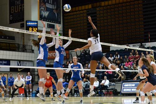 Sophomore Aaliya Davidson hits a ball in the Colonials' win against American. Davidson torched a career-high 17 kills in the match. Camille Ramasastry | Hatchet Photographer