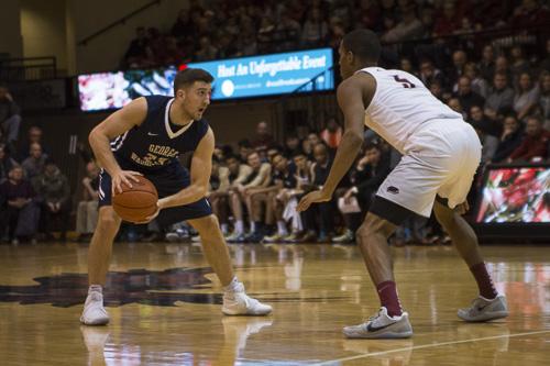 Redshirt junior point guard Jaren Sina went 5-for-8 from deep to lead GW with 15 points in a five-point loss at Saint Joseph's Friday. Ethan Stoler | Hatchet Photographer