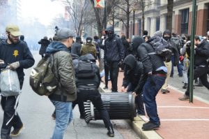 Some of the protestors broke away from the larger group and committed acts of vandalism, including setting a trash can on fire. Isabella Brodt | Hatchet Photographer